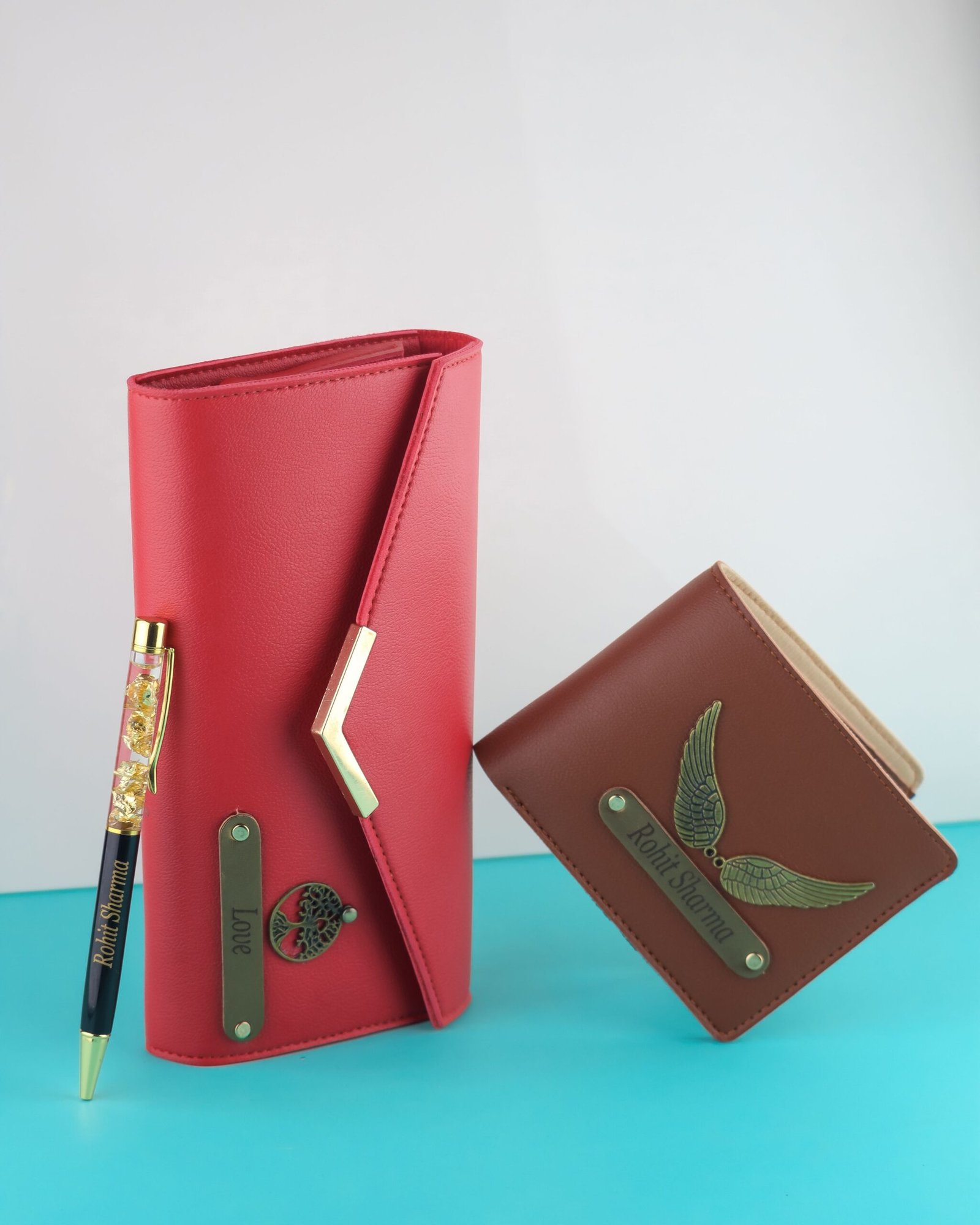 Stylish red wallet and brown cardholder with gold accents on a minimalist backdrop.